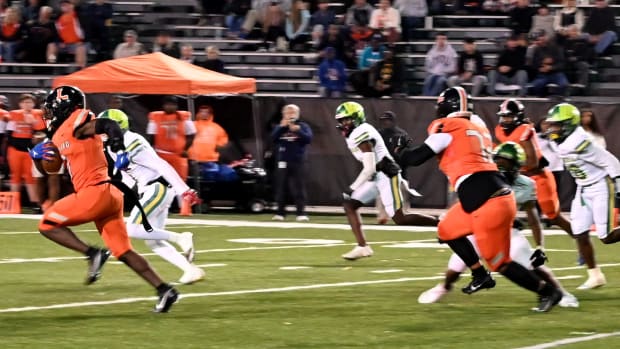 Lakeland running back D'marius Rucker breaks loose on a run against Lake Minneola on Friday during a Class 4S, Region 3 final at Bryant Stadium. He rushed for 351 yards.